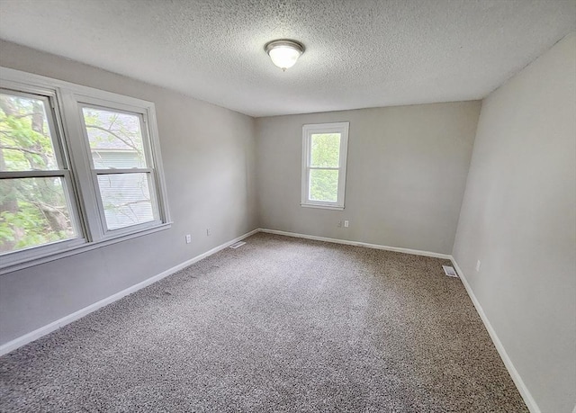 31 Harvard Ct, Dracut, MA 01826 - carpeted spare room featuring a textured ceiling and baseboards