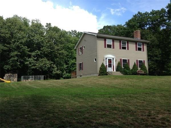 97 N Row Rd, Sterling, MA 01564 - colonial home with a chimney and a front yard