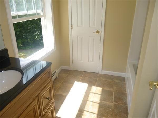 97 N Row Rd, Sterling, MA 01564 - full bath with vanity and baseboard heating