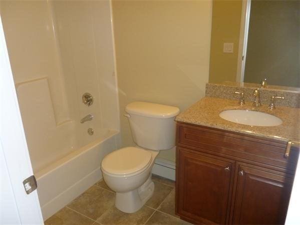 97 N Row Rd, Sterling, MA 01564 - bathroom featuring vanity, bathing tub / shower combination, tile patterned floors, and a baseboard heating unit