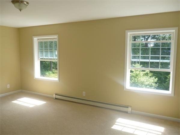 97 N Row Rd, Sterling, MA 01564 - unfurnished room with a baseboard heating unit, healthy amount of natural light, and carpet