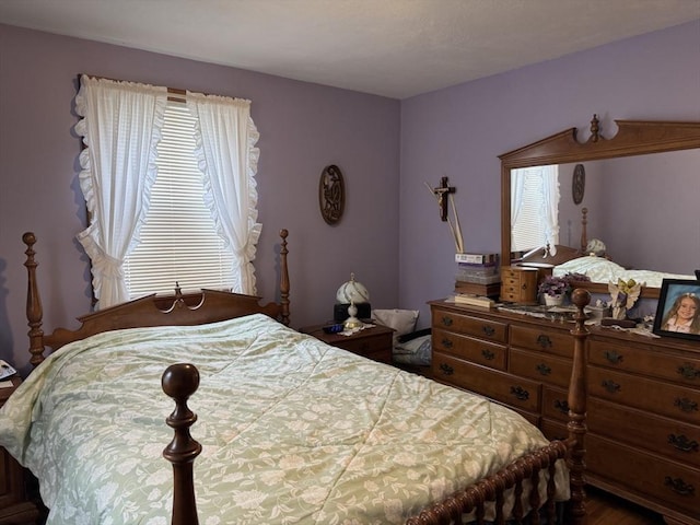 bedroom featuring multiple windows