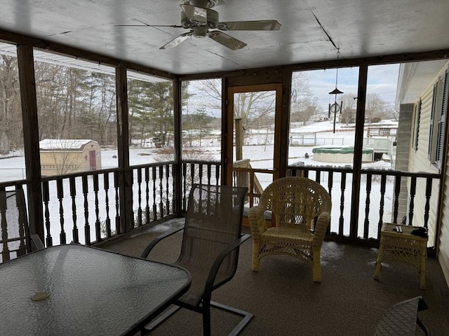 sunroom featuring ceiling fan