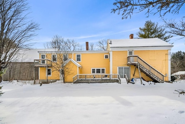 view of snow covered house