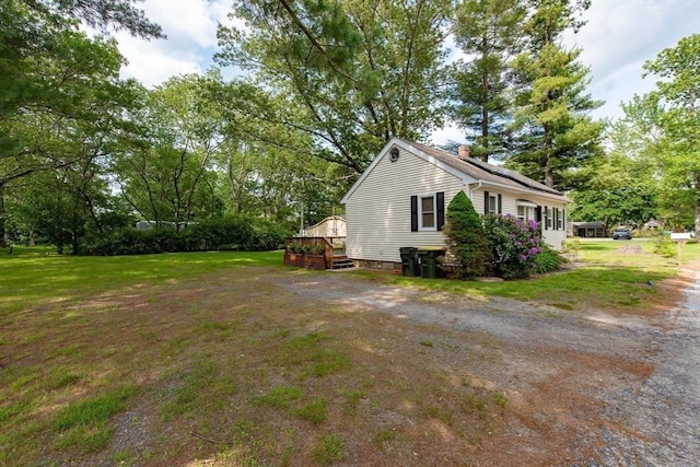 23 Mohawk St, Bellingham, MA 02019 - view of property exterior with a lawn and a wooden deck