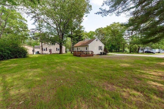 23 Mohawk St, Bellingham, MA 02019 - view of grassy yard featuring a deck