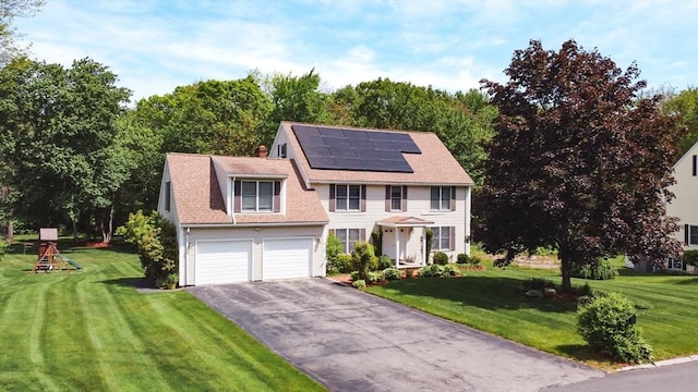 11 Balmoral Dr, Methuen, MA 01844 - colonial-style house featuring asphalt driveway, solar panels, and a front yard