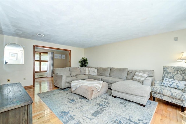 11 Balmoral Dr, Methuen, MA 01844 - living room featuring wood finished floors, baseboard heating, and baseboards