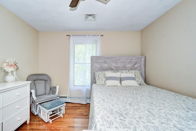 11 Balmoral Dr, Methuen, MA 01844 - bedroom featuring wood finished floors, a baseboard heating unit, and ceiling fan