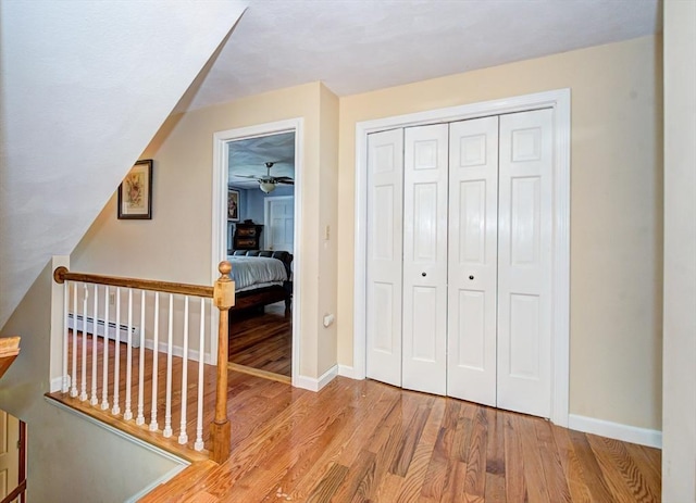 11 Balmoral Dr, Methuen, MA 01844 - bedroom featuring baseboard heating, wood finished floors, baseboards, and a closet