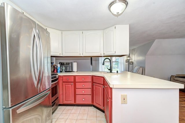 11 Balmoral Dr, Methuen, MA 01844 - kitchen featuring stainless steel appliances, a sink, a peninsula, light countertops, and white cabinets