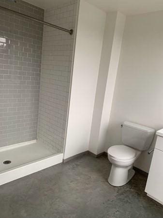 160 Water St Unit 212, Williamstown, MA 01267 - bathroom with a shower stall, toilet, vanity, and baseboards
