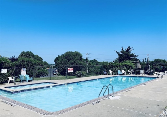 view of swimming pool with a patio area