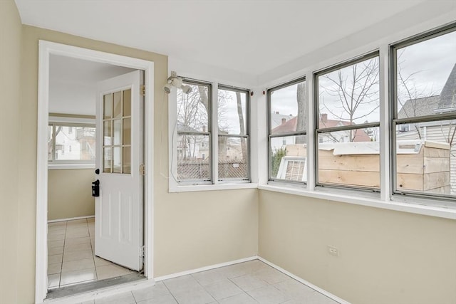 unfurnished sunroom with plenty of natural light