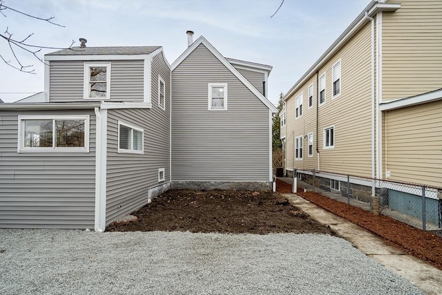 view of property exterior with fence