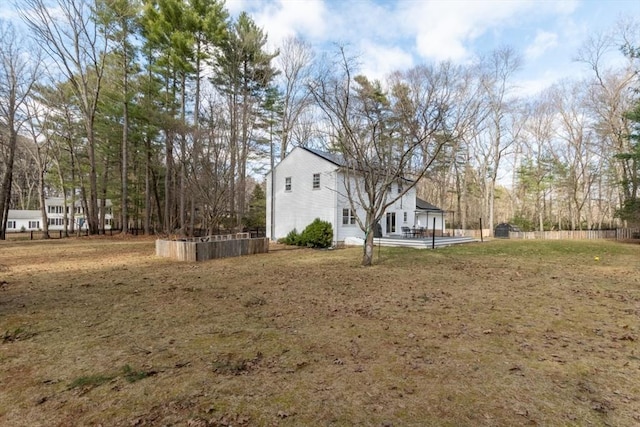 view of yard with fence and a patio