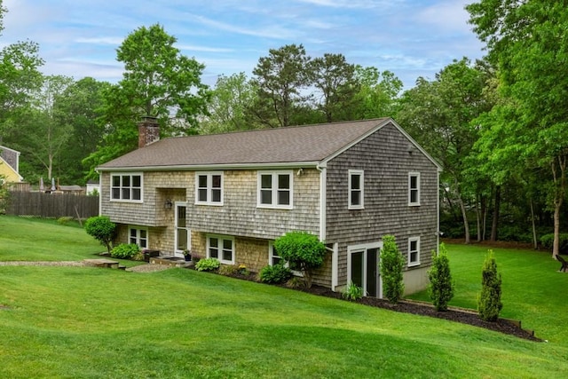 13 Shagbark Rd, Sandwich, MA 02644 - split foyer home with a chimney and roof with shingles