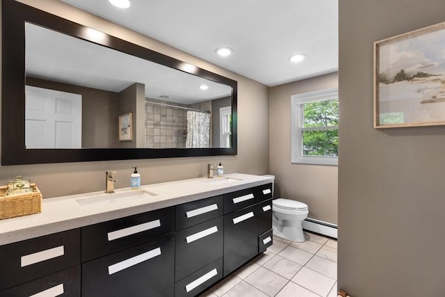 13 Shagbark Rd, Sandwich, MA 02644 - bathroom featuring a baseboard heating unit, double vanity, toilet, tile patterned flooring, and recessed lighting