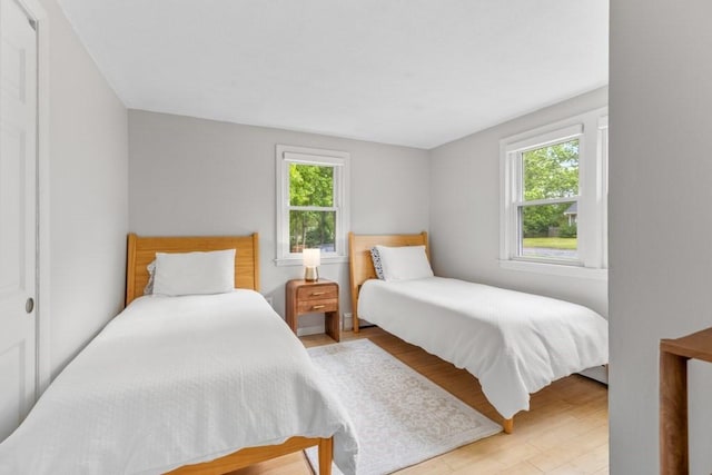13 Shagbark Rd, Sandwich, MA 02644 - bedroom with multiple windows and wood finished floors