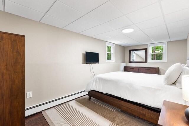 13 Shagbark Rd, Sandwich, MA 02644 - bedroom with a baseboard radiator, wood finished floors, and a paneled ceiling