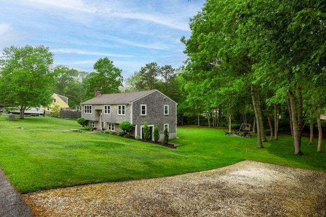 13 Shagbark Rd, Sandwich, MA 02644 - view of home's exterior featuring a chimney and a lawn