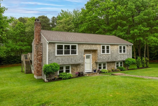 13 Shagbark Rd, Sandwich, MA 02644 - raised ranch featuring a chimney, a front lawn, stairway, and a deck