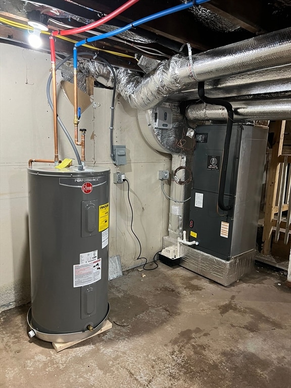 utility room featuring water heater