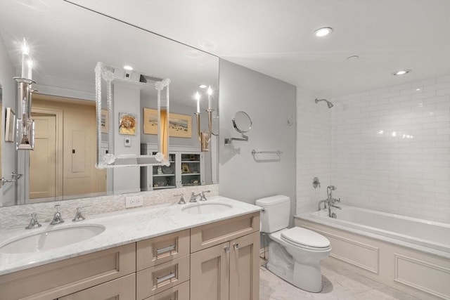 full bathroom with tiled shower / bath combo, vanity, and toilet