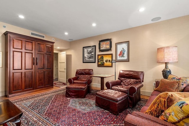 sitting room with hardwood / wood-style floors