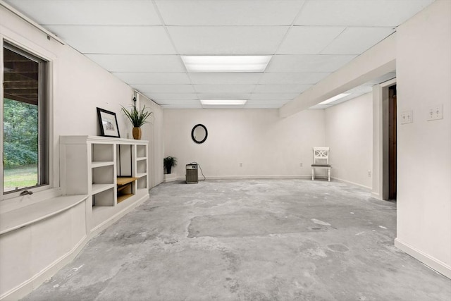 42 Brickett Hill Cir Unit 114, Haverhill, MA 01830 - basement featuring a paneled ceiling and baseboards