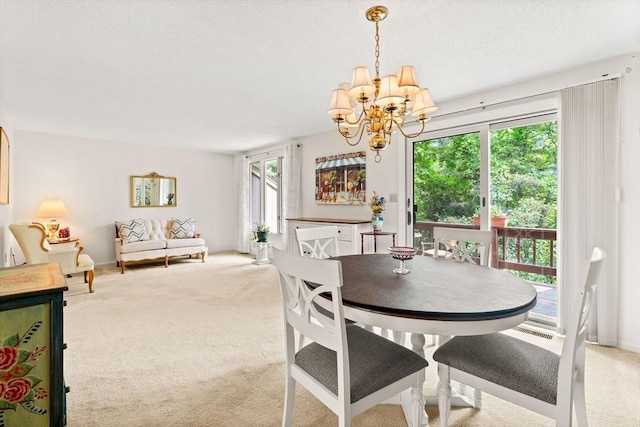 42 Brickett Hill Cir Unit 114, Haverhill, MA 01830 - dining space featuring a chandelier and light colored carpet