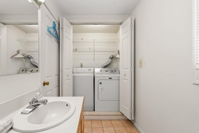 42 Brickett Hill Cir Unit 114, Haverhill, MA 01830 - bathroom with washing machine and clothes dryer and tile patterned flooring