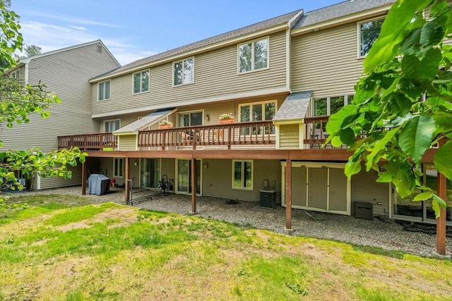 42 Brickett Hill Cir Unit 114, Haverhill, MA 01830 - rear view of house featuring a deck and a lawn