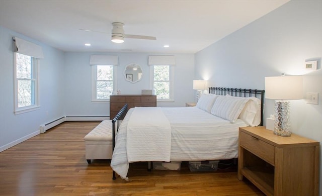 bedroom with recessed lighting, baseboards, wood finished floors, and a ceiling fan