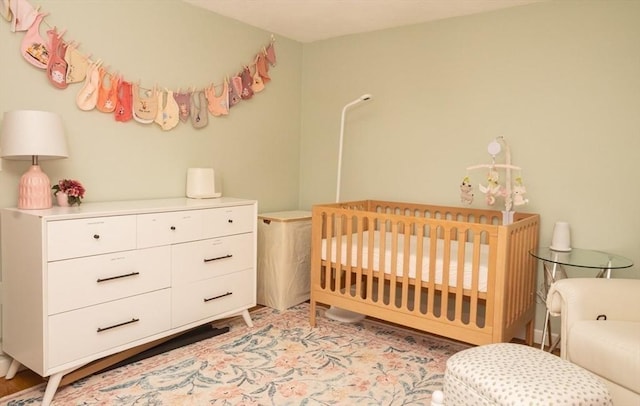 bedroom featuring a crib