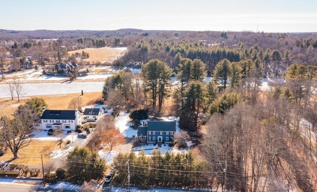 birds eye view of property with a forest view