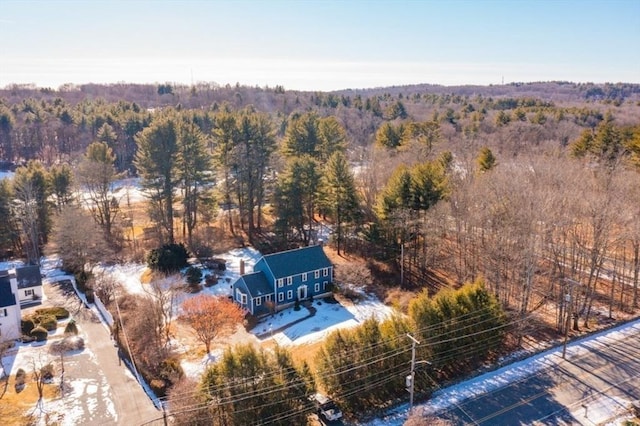 aerial view featuring a wooded view