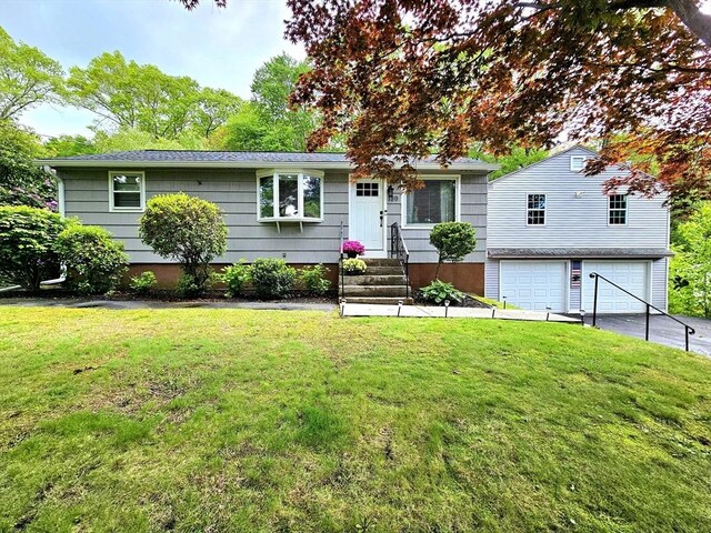 189 Brigham Hill Rd, Grafton, MA 01536 - view of front facade with an attached garage, driveway, and a front yard