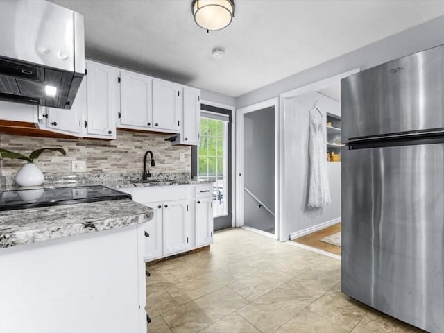 189 Brigham Hill Rd, Grafton, MA 01536 - kitchen with freestanding refrigerator, a sink, ventilation hood, backsplash, and white cabinets