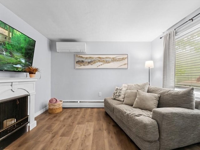 189 Brigham Hill Rd, Grafton, MA 01536 - living room featuring a wall mounted air conditioner, a baseboard heating unit, wood finished floors, baseboards, and a fireplace