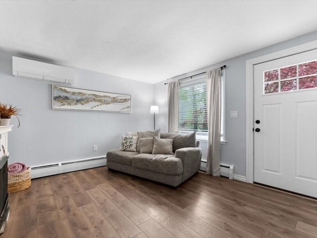 189 Brigham Hill Rd, Grafton, MA 01536 - living area featuring an AC wall unit, a baseboard radiator, wood finished floors, and a baseboard heating unit