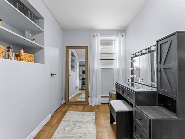 189 Brigham Hill Rd, Grafton, MA 01536 - bathroom featuring wood finished floors, baseboard heating, and baseboards