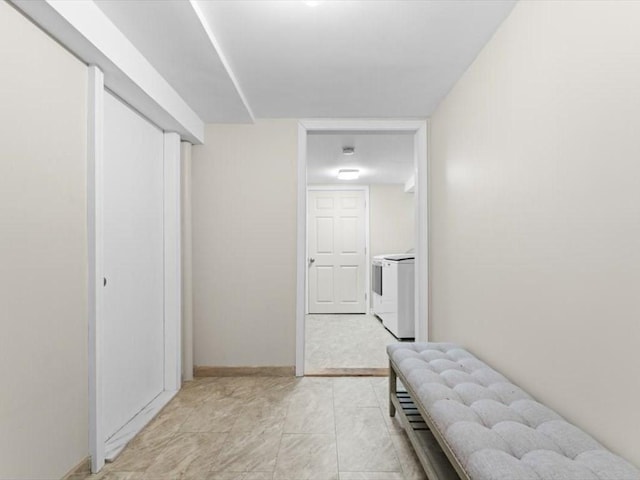 189 Brigham Hill Rd, Grafton, MA 01536 - hallway with washing machine and dryer and baseboards
