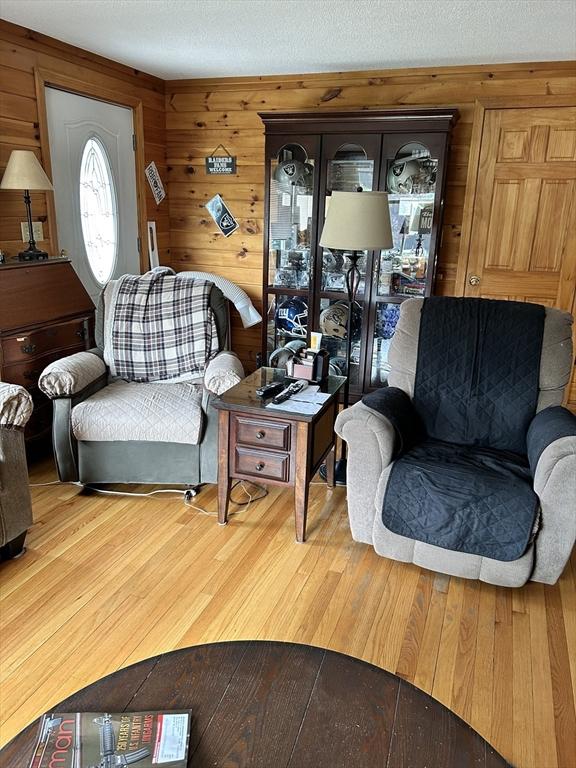 554 Main St, Becket, MA 01223 - living room featuring wood finished floors and wood walls