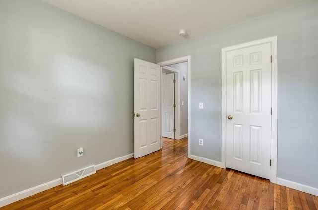 62 Forest St, Middleboro, MA 02346 - unfurnished bedroom with wood-type flooring and baseboards