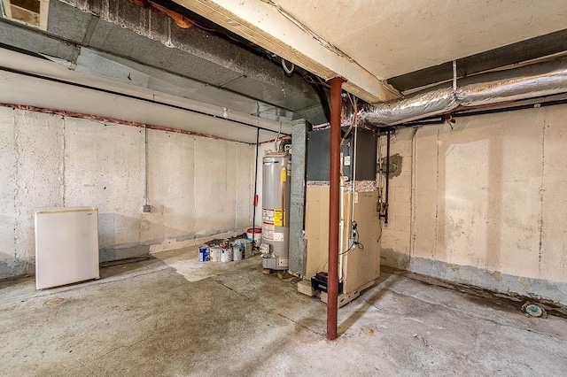 62 Forest St, Middleboro, MA 02346 - unfinished basement with gas water heater and heating unit