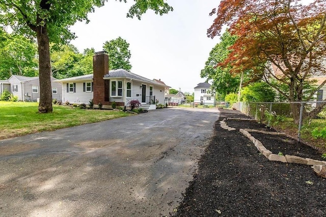 62 Forest St, Middleboro, MA 02346 - view of front of home with a chimney and driveway