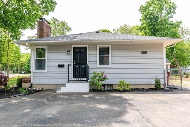 62 Forest St, Middleboro, MA 02346 - view of front of property featuring a chimney and roof with shingles