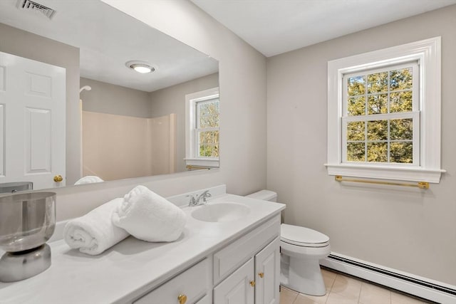 full bath featuring toilet, a baseboard heating unit, vanity, visible vents, and tile patterned floors