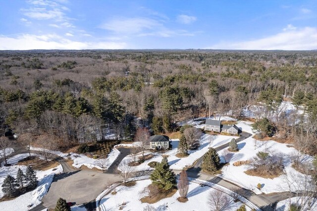 birds eye view of property with a wooded view